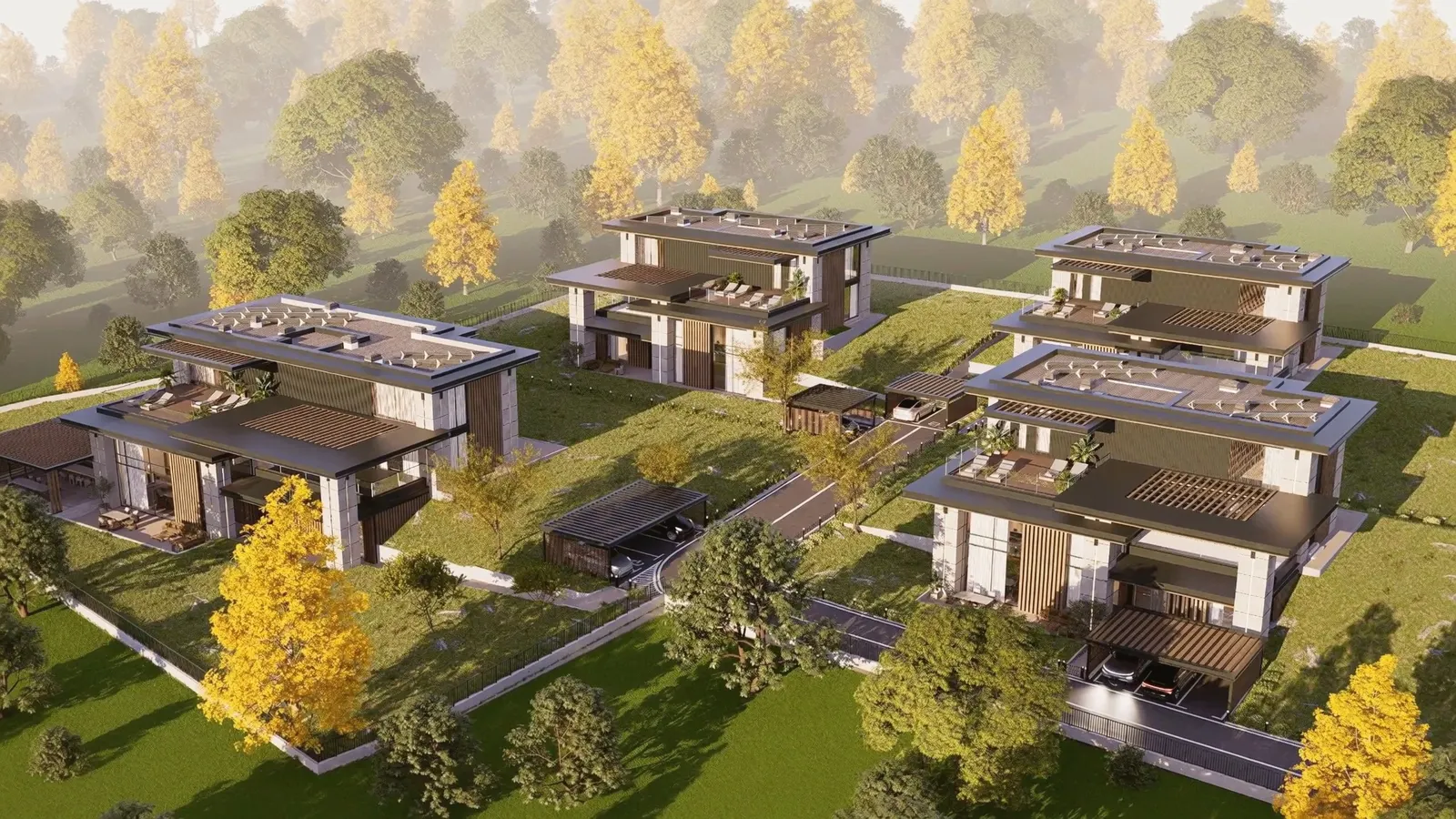 Четирите къщи на Boutique Residence от въздуха в есенен следобед: плоски покриви с тераси и перголи, травертинови колони и дъбови ламели, вътрешният път с навесите за коли и пожълтели дървета наоколо
